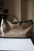 Borsa da viaggio Gucci in canvas GG beige